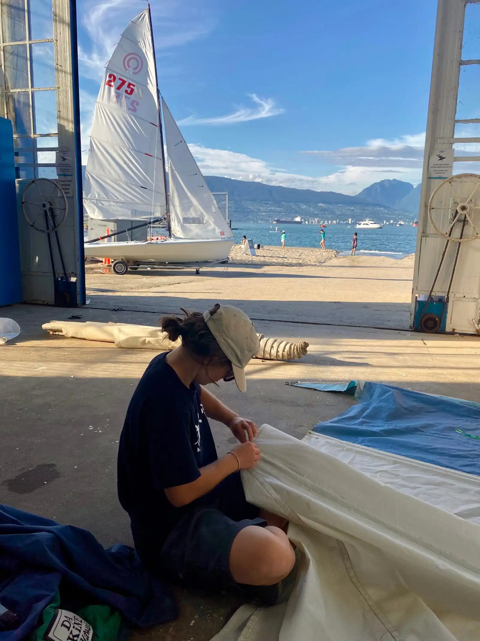Anouk repairing sails.